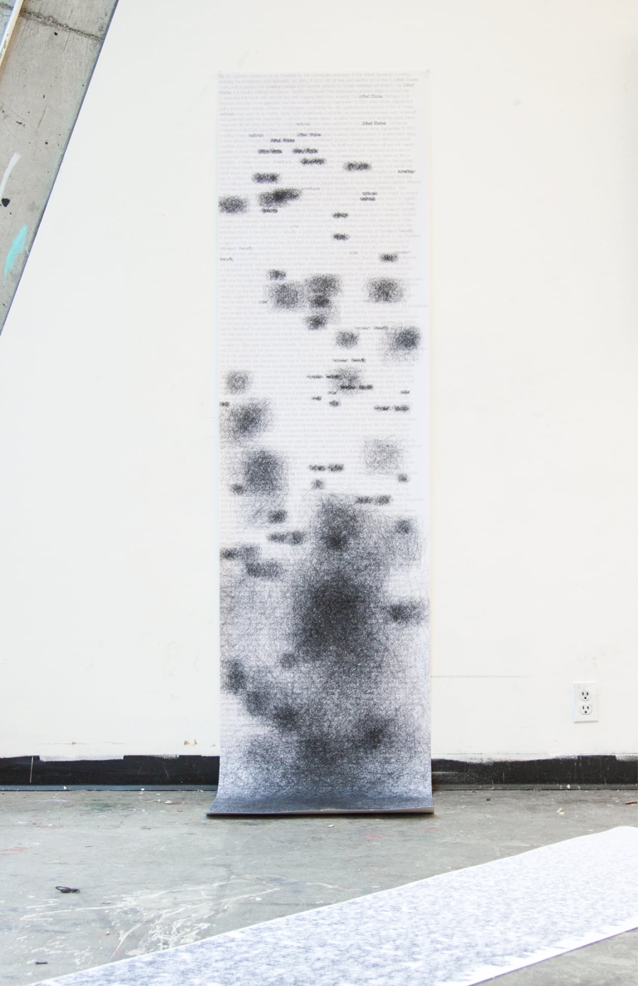 Very long poster hanging on a wall